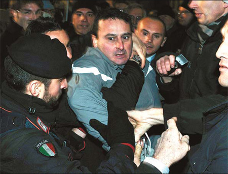 Berlusconi OK after assault