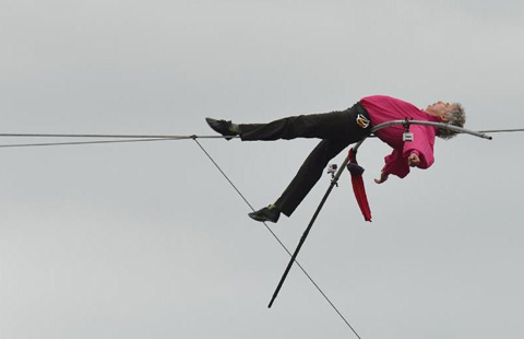 tightrope walker completes walk over seine river in paris
