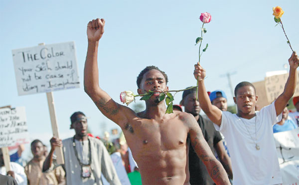 Ferguson police arrest 47 as protest degenerates