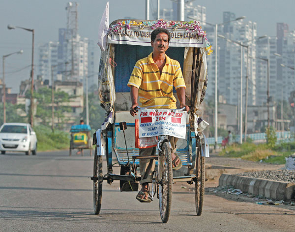 Rickshaw driver on top of the world
