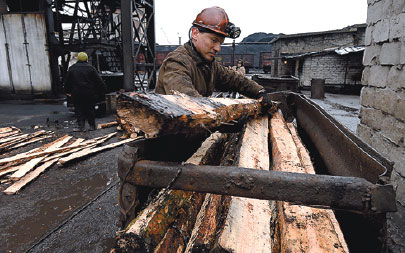 Deep below ground, miners work on in east Ukraine