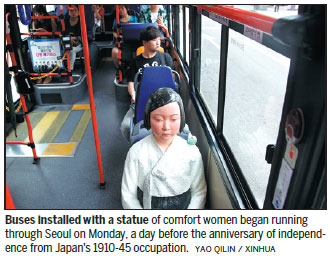 'Comfort women' statues take their seats for bus project