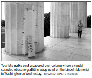 Visitors denounce memorial grafitti