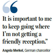Merkel vows to press on with rallies despite jeers