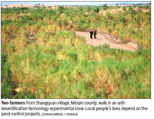 Minqin county battles to hold back Badain Jaran and Tengger deserts