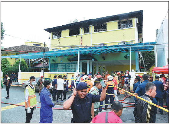 Malaysia fire blocks lone exit, 23 dead