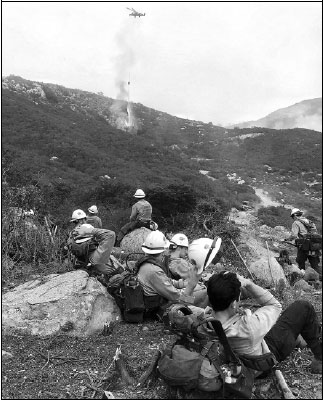 Firefighters wrestle to control wildfire