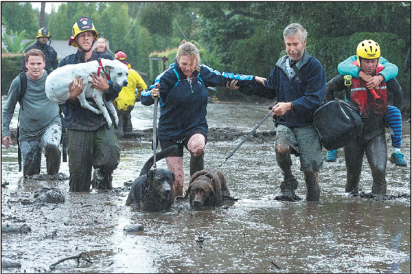 13 killed as storm triggers mudslides