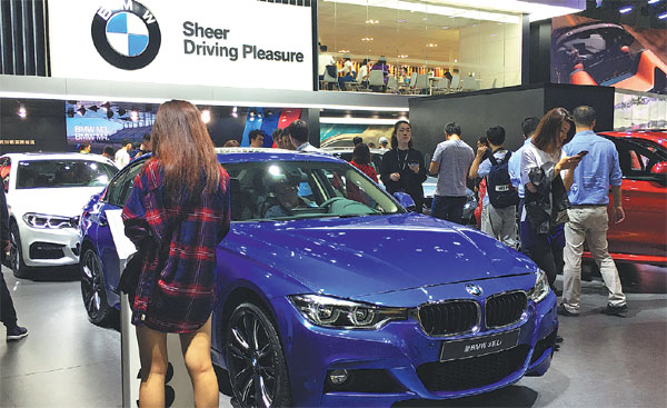 BMW steers through flagging market, lands key victories