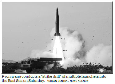 Kim oversees testing of multiple rocket launchers