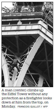 Police save an Eiffel Tower climber