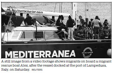 Migrants disembark in Italy after rescue boat defies ban