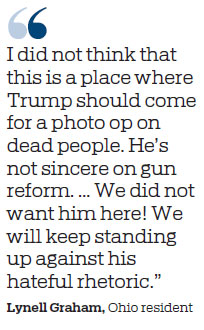 Hostility as Trump visits gun victims