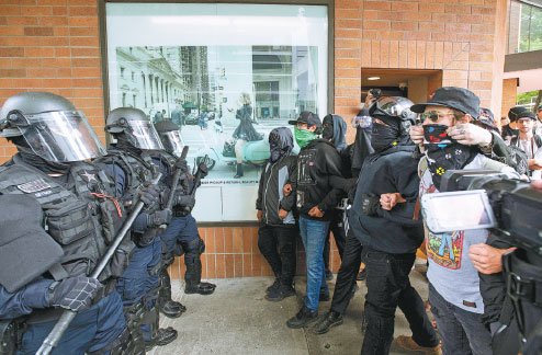 Portland street clashes renew legislative debate over masks