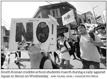 Seoul slams Tokyo as curbs take effect