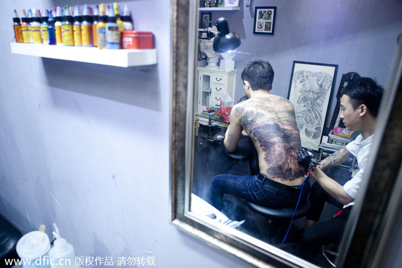 Legendary painting tattooed on man's back