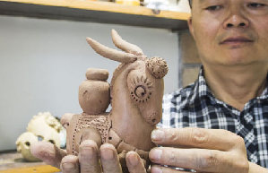 Purple clay pottery artisan follows dream