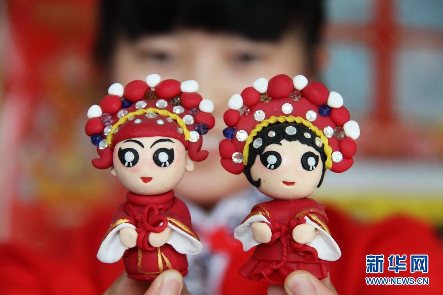 Dough figurines pinched for Chinese Valentine's Day