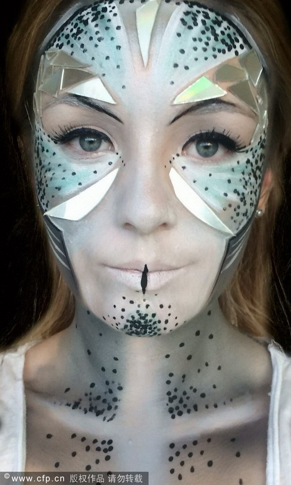 Make-up artist creates special-effects on her face