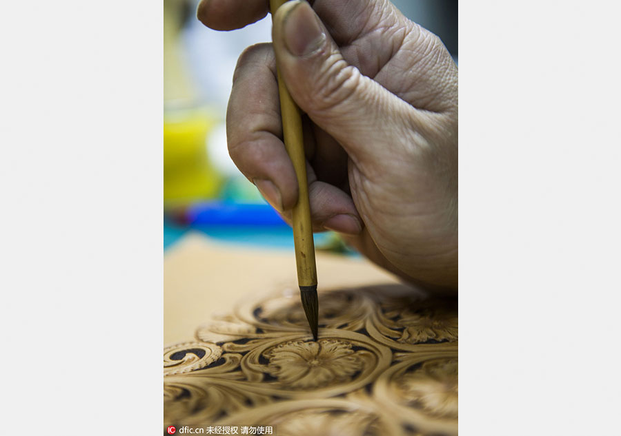 A leather engraver's meditative craft