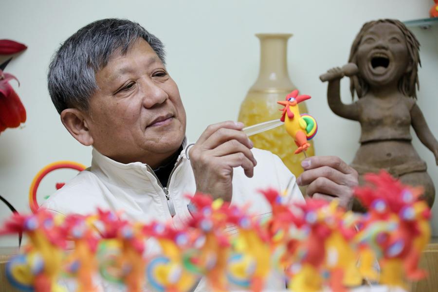 Rooster-shaped dough modellings made to greet Chinese lunar new year