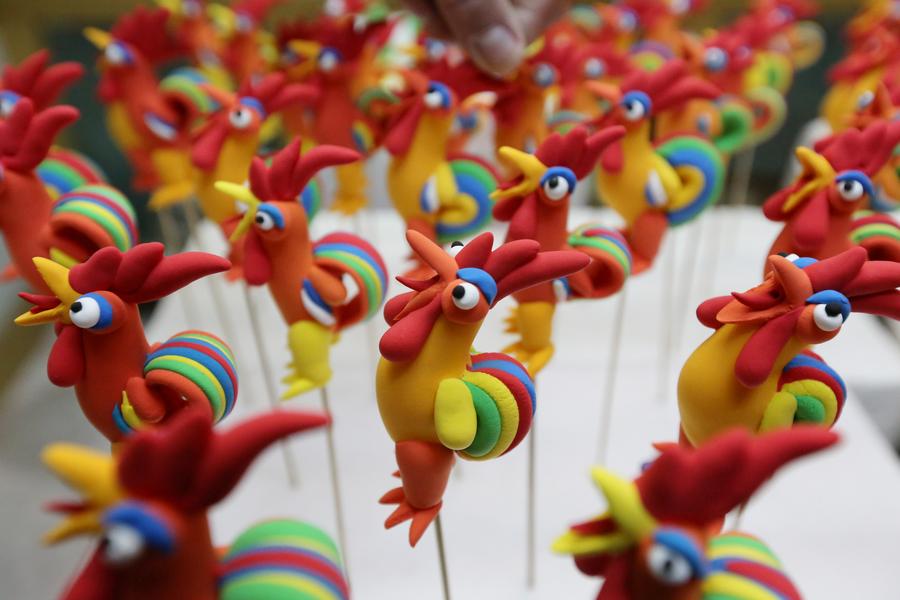 Rooster-shaped dough modellings made to greet Chinese lunar new year