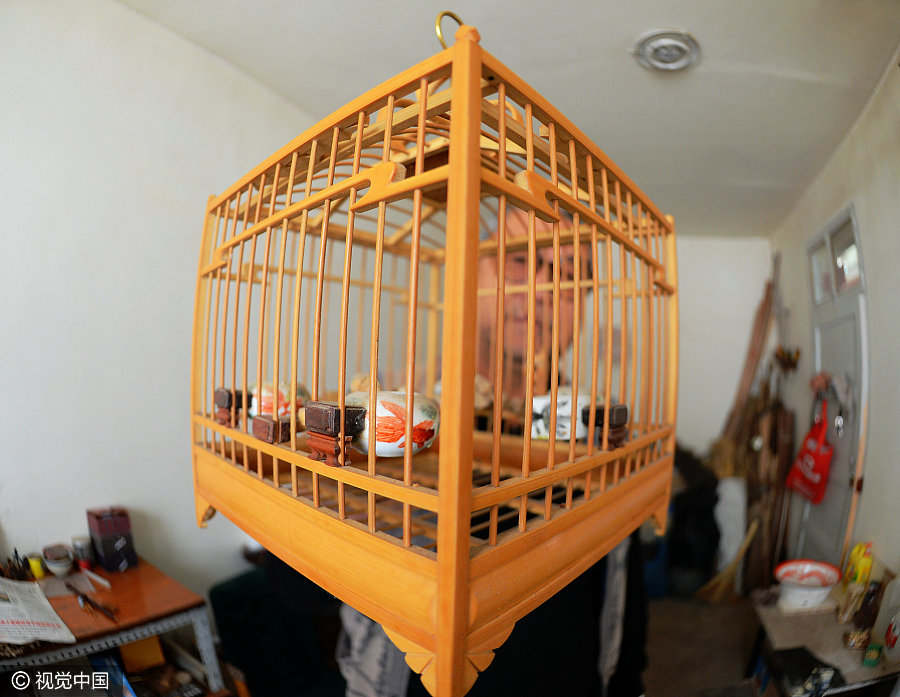 Folk artist dedicated to making bird cages