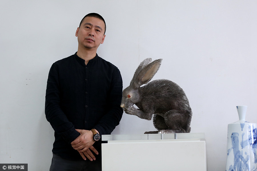 Artist creates needlework, calling for animal protection