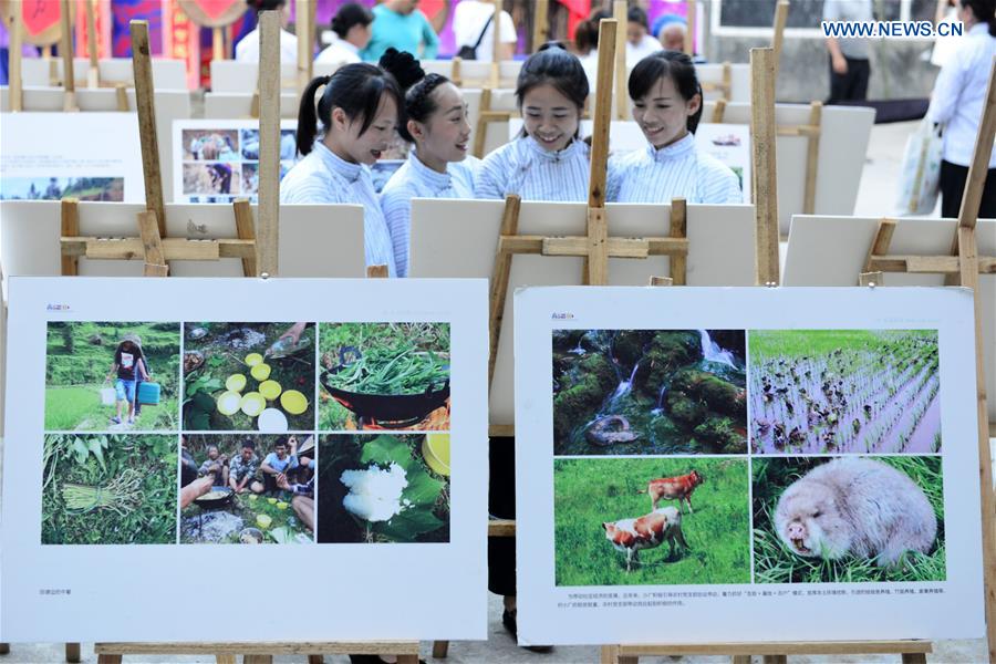 Photo exhibition on customs, life of villagers held in SW China