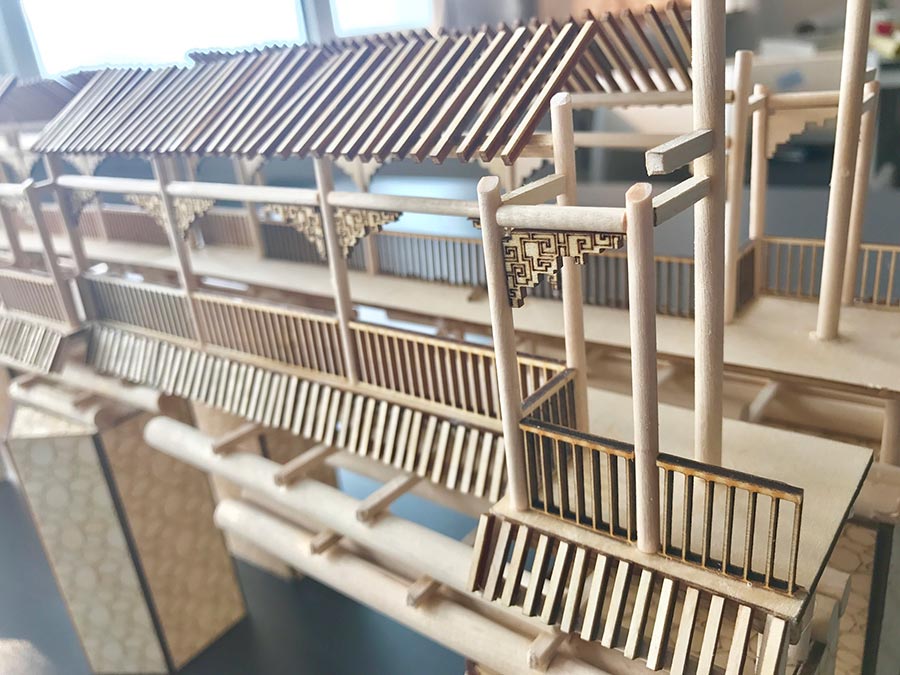 College students miniature Palace Museum on a wooden board