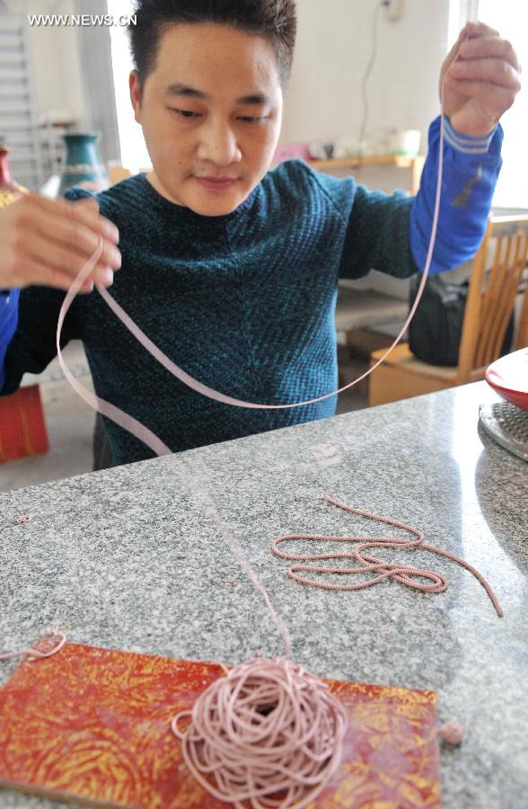 Lacquer thread sculpting listed as one of China's national intangible heritages