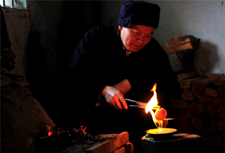 Inheritor of reed-pipe wind instrument 'Lusheng' in Guizhou