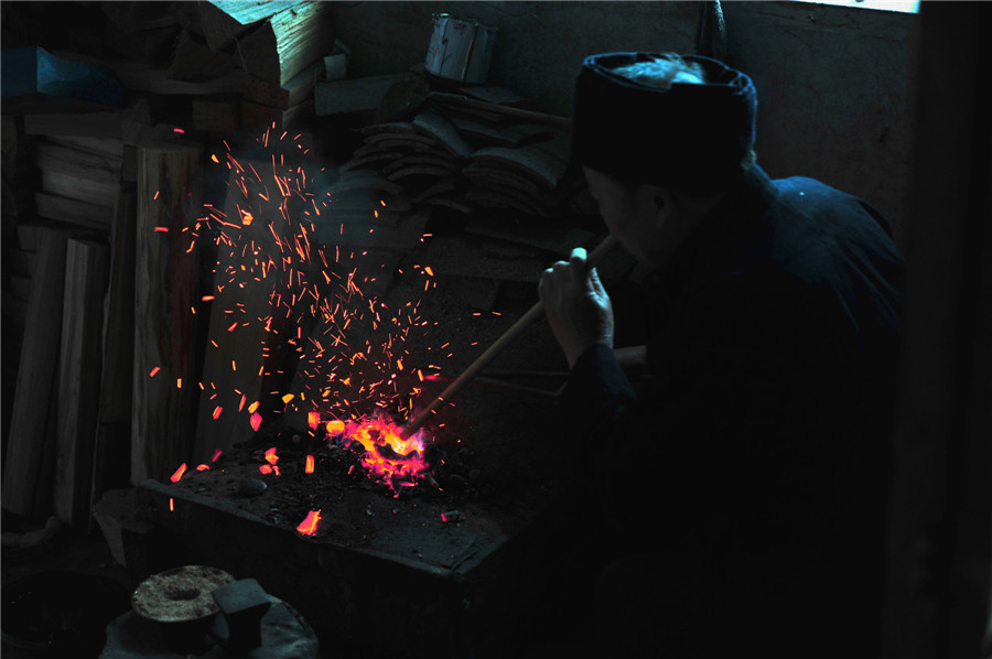 Inheritor of reed-pipe wind instrument 'Lusheng' in Guizhou