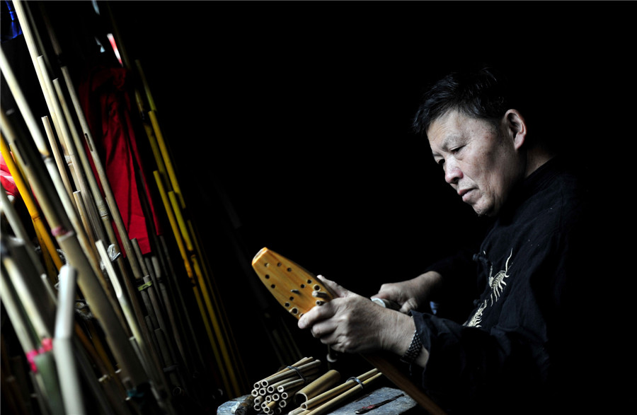 Inheritor of reed-pipe wind instrument 'Lusheng' in Guizhou
