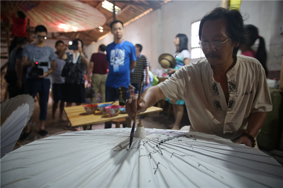 Traditional oil paper umbrellas shine in modern age