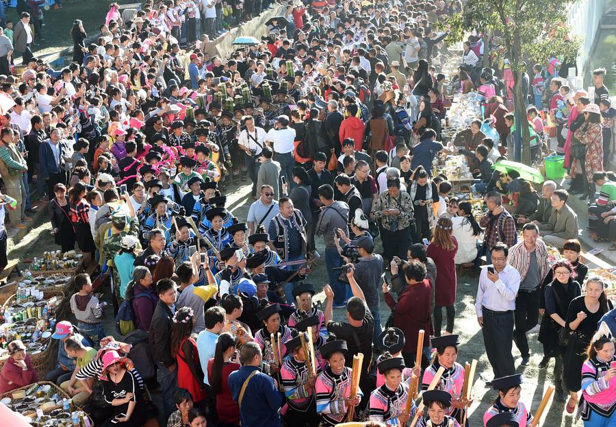 Locals enjoy themselves during traditional festival in Yunnan