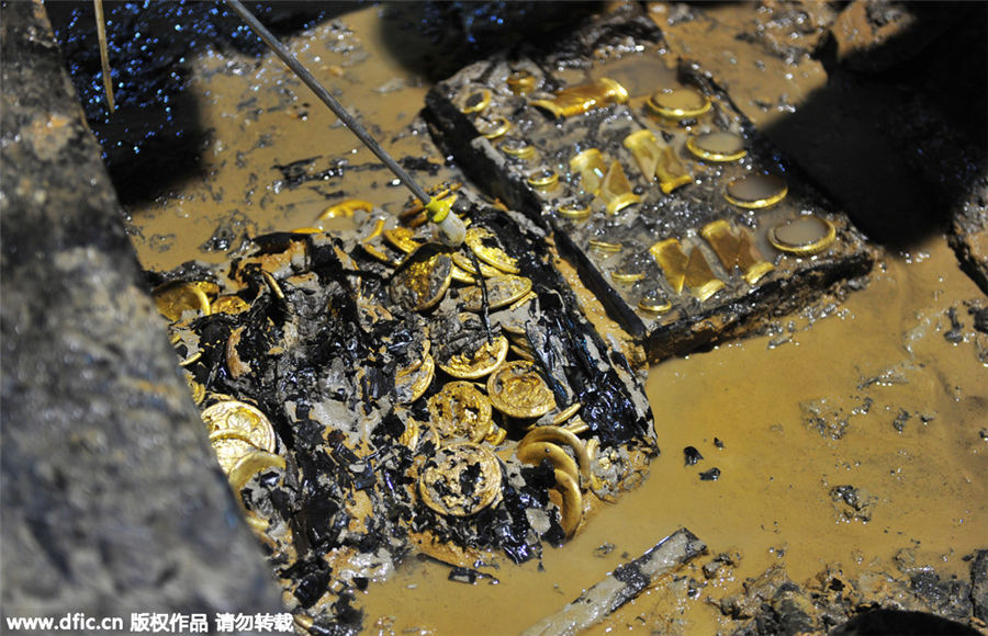 Gold coins, hoofs found in 2,000-year-old Chinese tomb