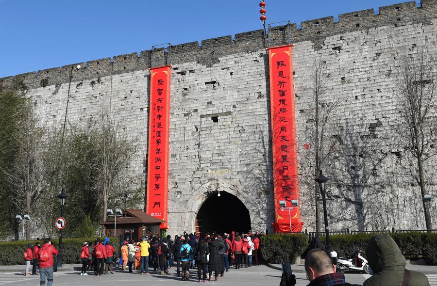 Spring Festival couplets flank gate on Nanjing city wall