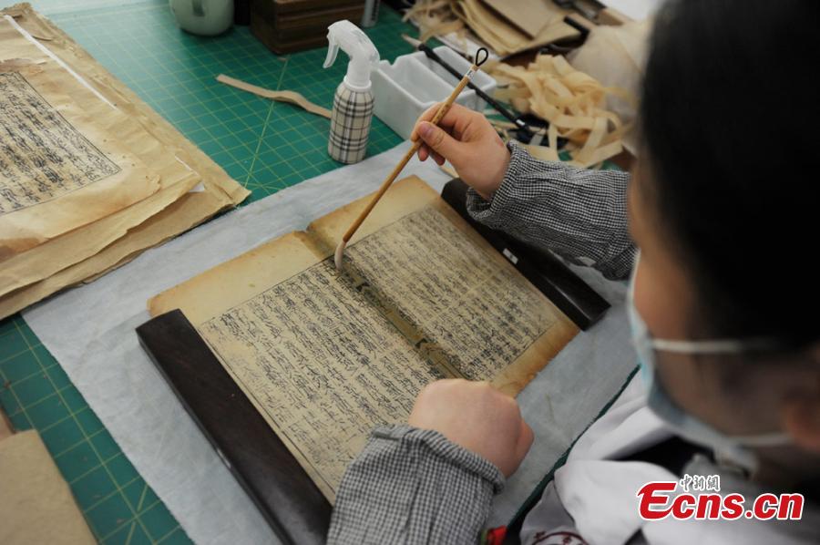 Great efforts needed to restore ancient books