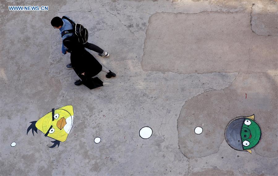 Cartoon figures painted on manhole covers in Shandong