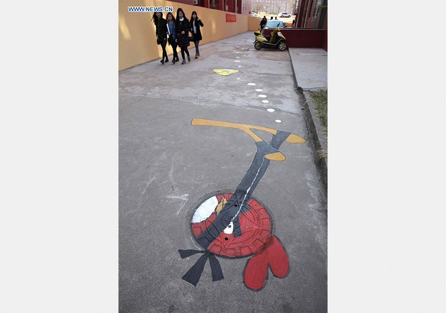 Cartoon figures painted on manhole covers in Shandong