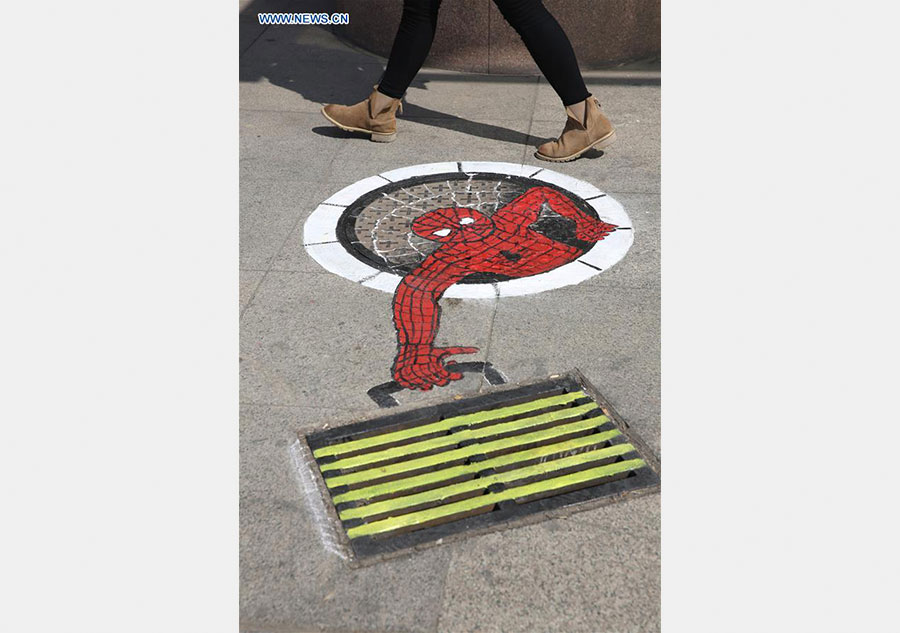 Cartoon figures painted on manhole covers in Shandong
