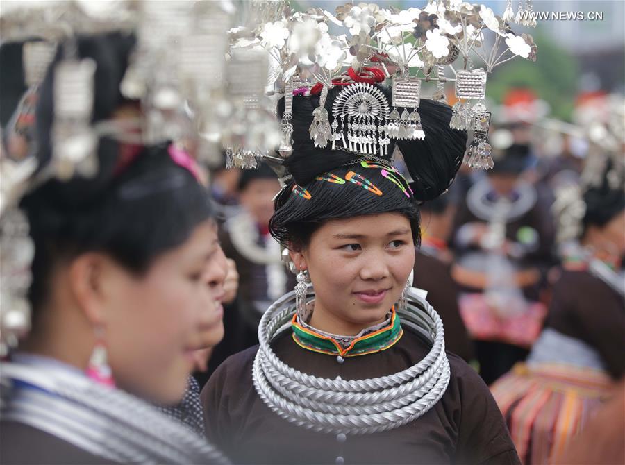 Traditional costumes of Miao ethnic group displayed on parade show in Southwest China