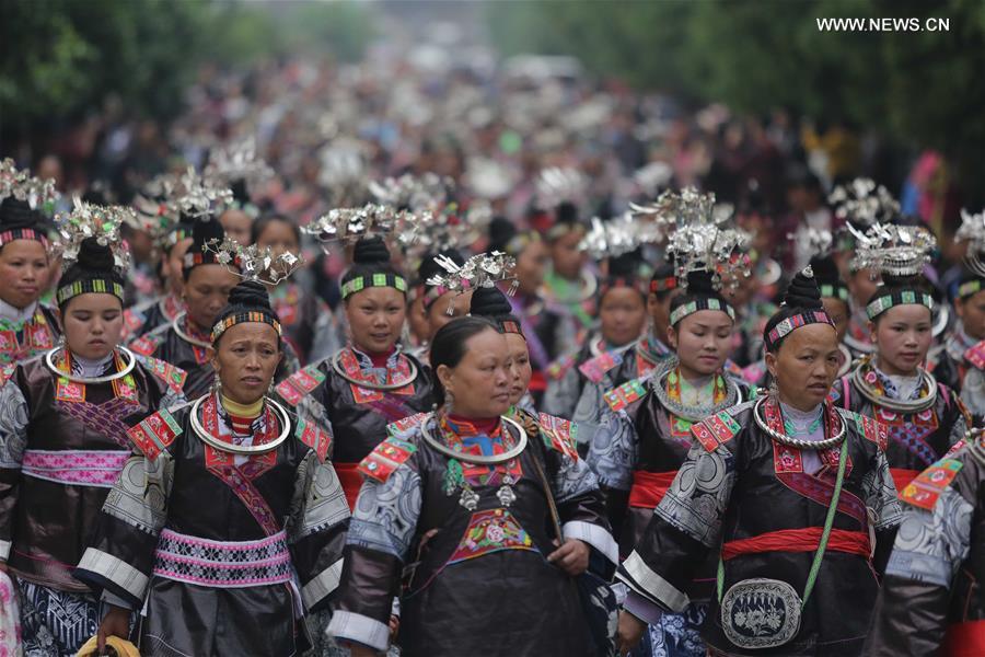 Traditional costumes of Miao ethnic group displayed on parade show in Southwest China