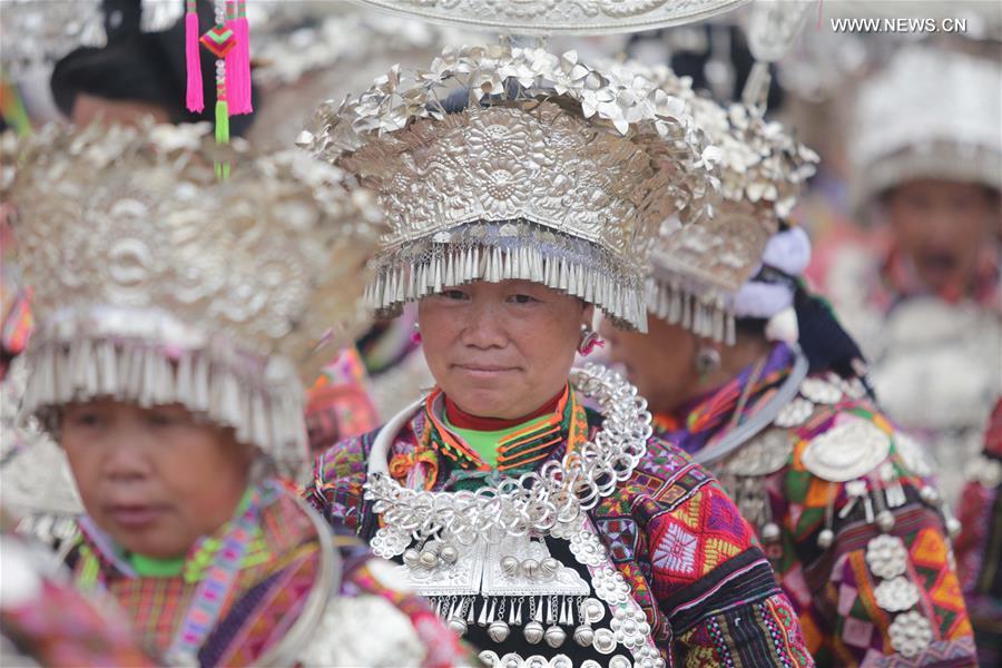 Traditional costumes of Miao ethnic group displayed on parade show in Southwest China