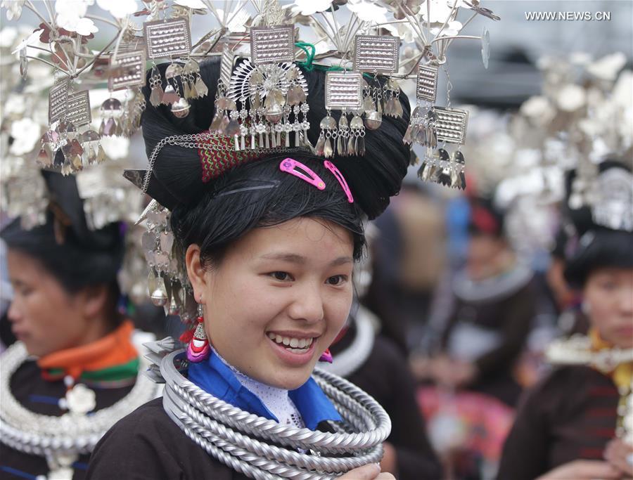 Traditional costumes of Miao ethnic group displayed on parade show in Southwest China