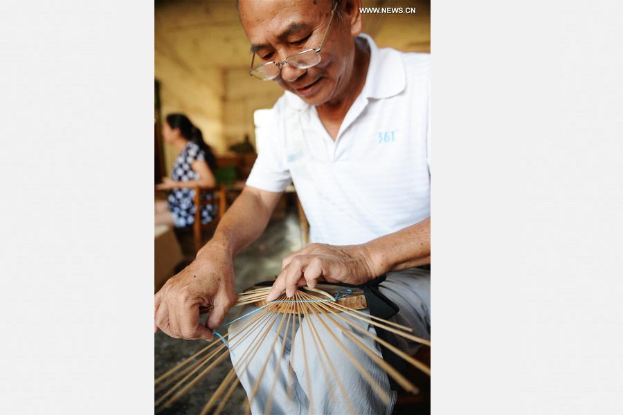 Traditional moon-shaped fan made in Guangxi