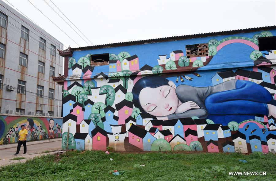 Qiannanbu village in N China covered with cultural graffiti works