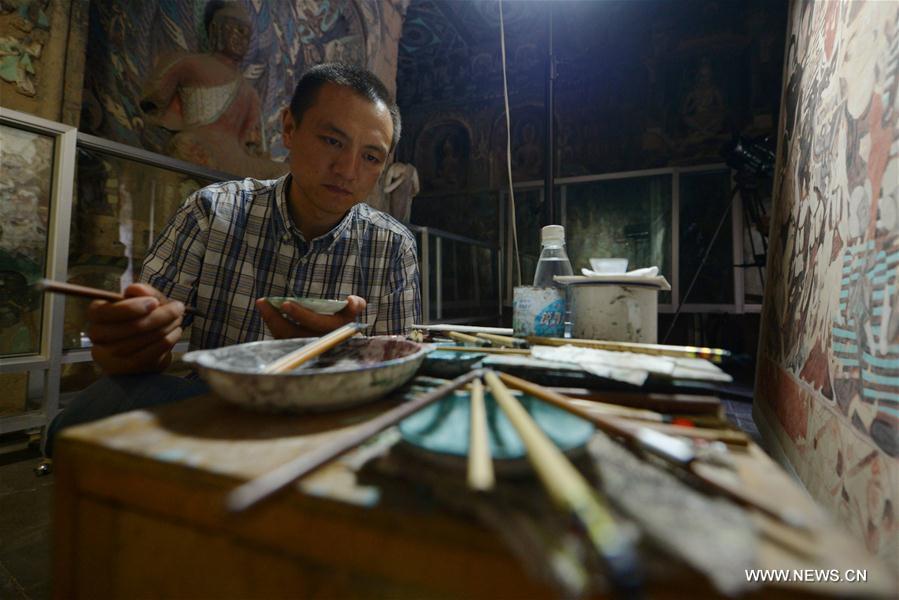 Films based on murals in cave of Mogao Grottoes completed