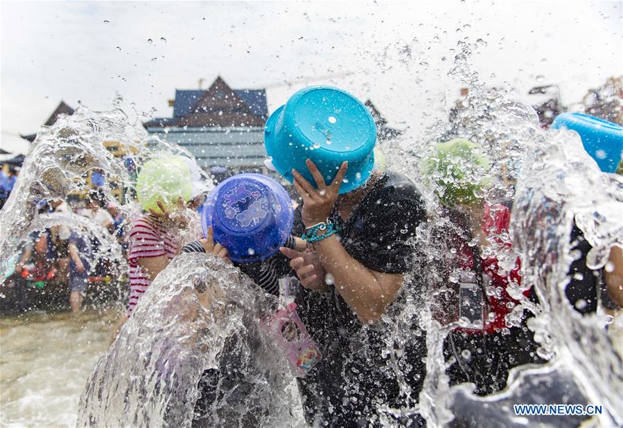 Water-sprinkling festival marked in SW China